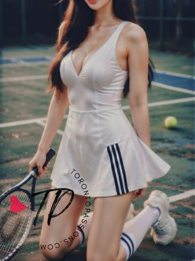 Beautiful woman in tennis dress holding racket on court.