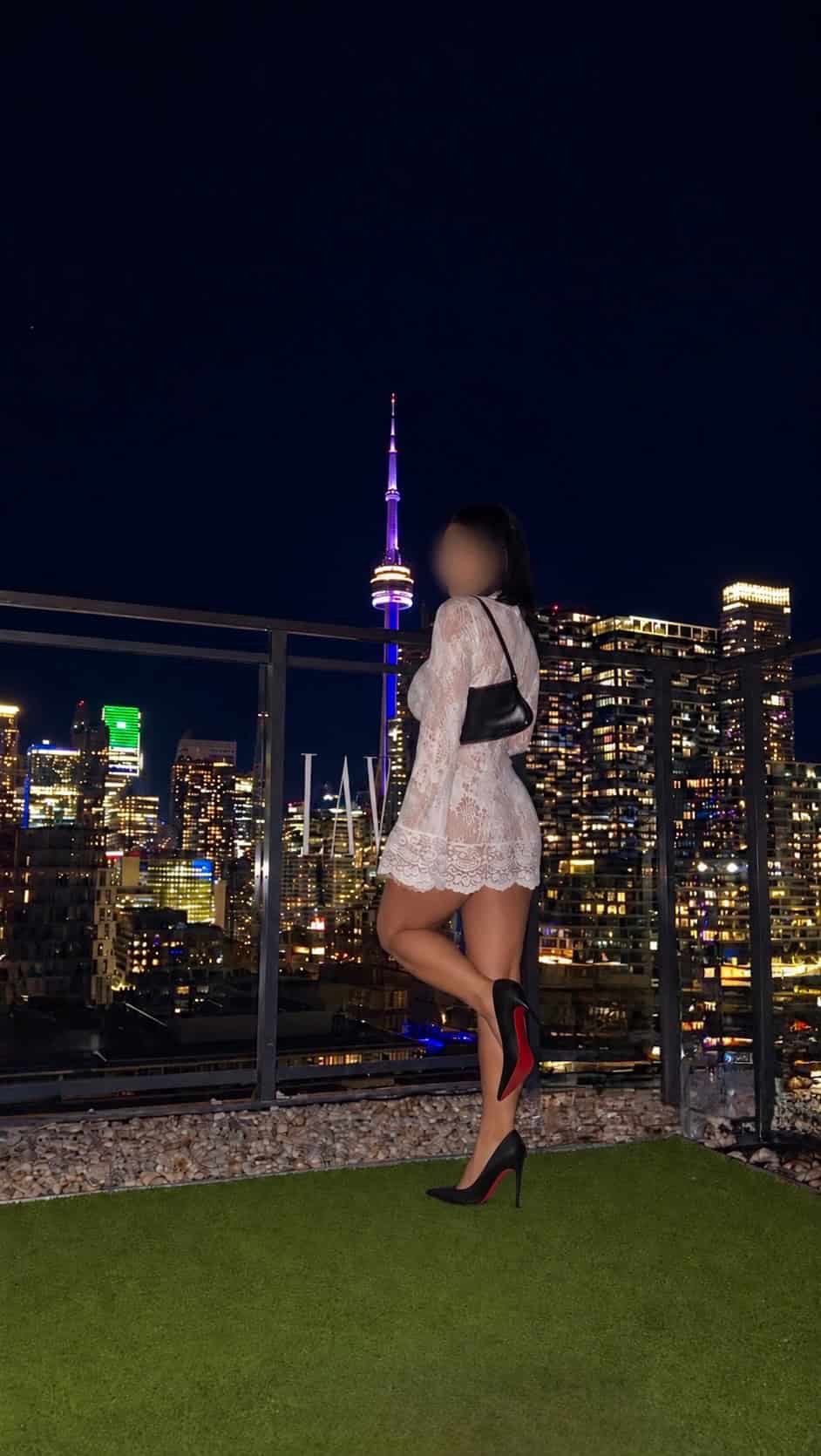 Woman in dress with city skyline